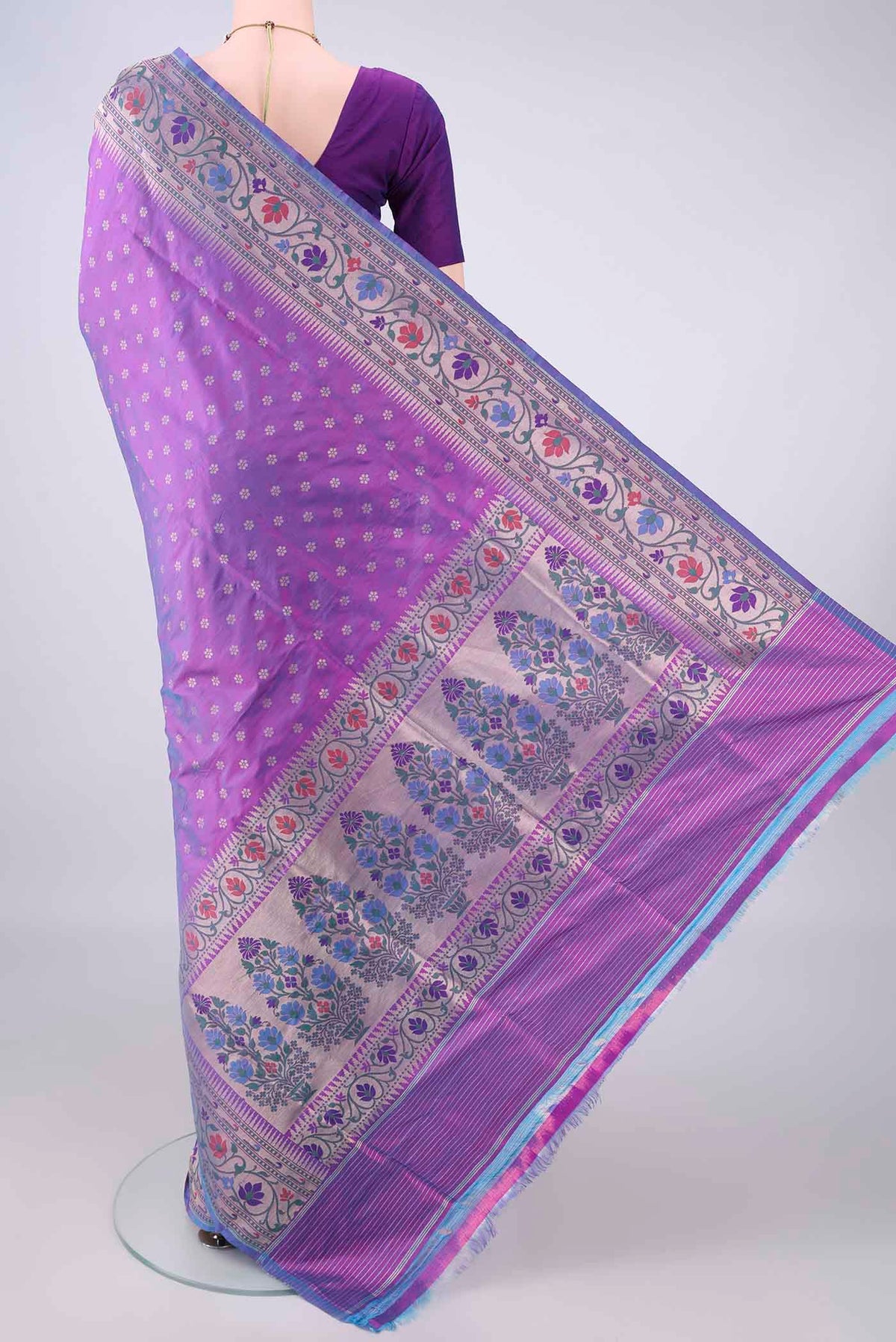 Flat view of Pure Silk Purple Banarasi Saree with Zari Butta on the body and Meenakari Border. 