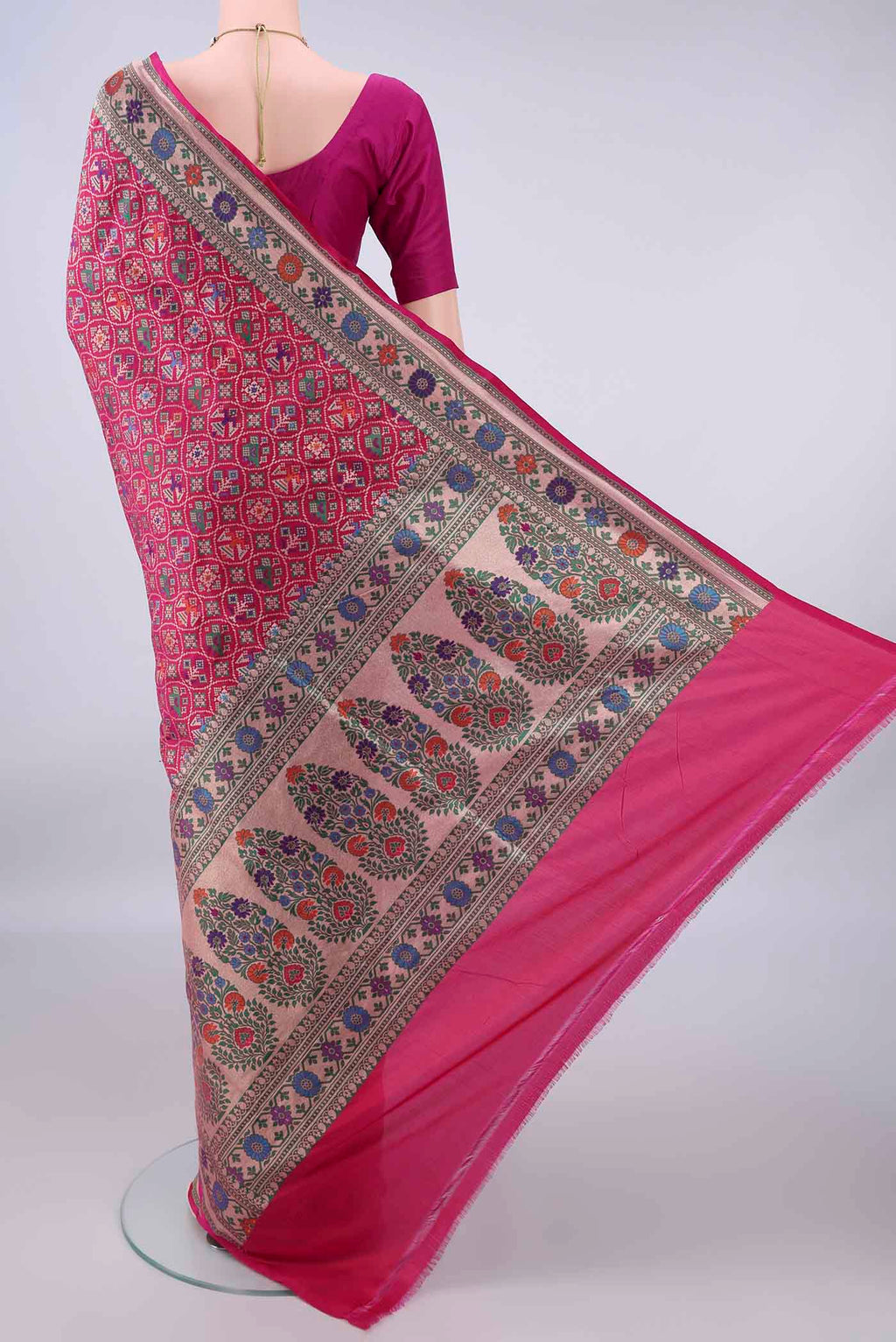 Flat view of Pure Silk Rani Pink Banarasi Saree with Zari Brocade on the body and Zari Border. 