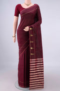 Pure Silk Maroon Kanchipuram Saree with Zari Butta on the body and Zari Border.  displayed on a mannequin