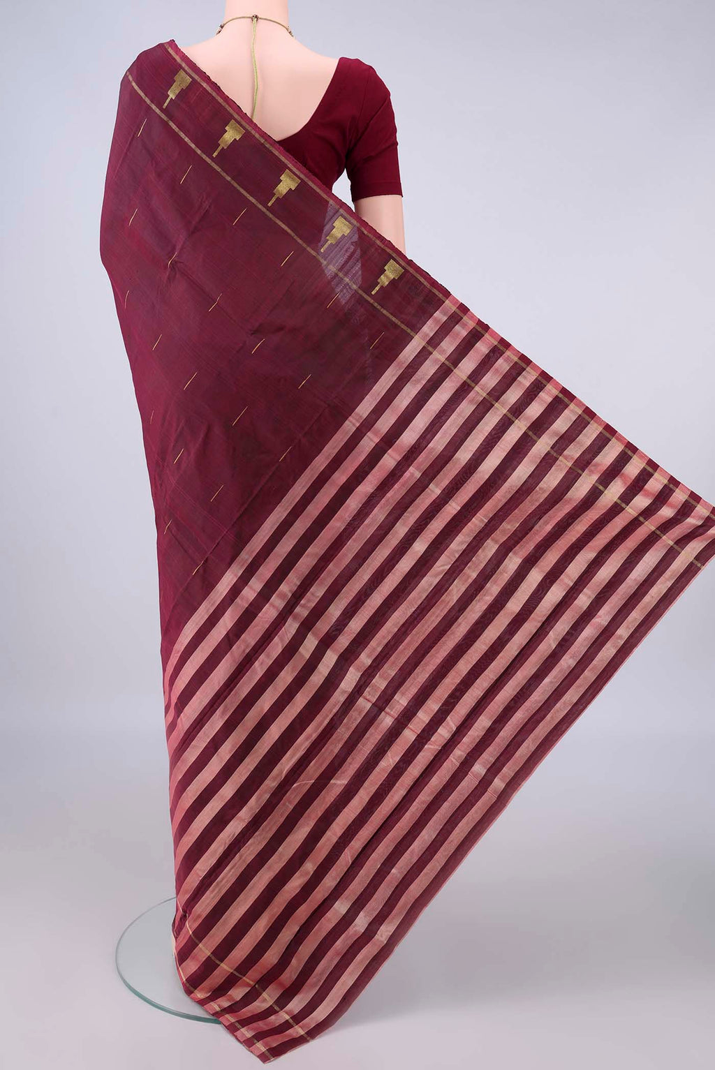 Flat view of Pure Silk Maroon Kanchipuram Saree with Zari Butta on the body and Zari Border. 