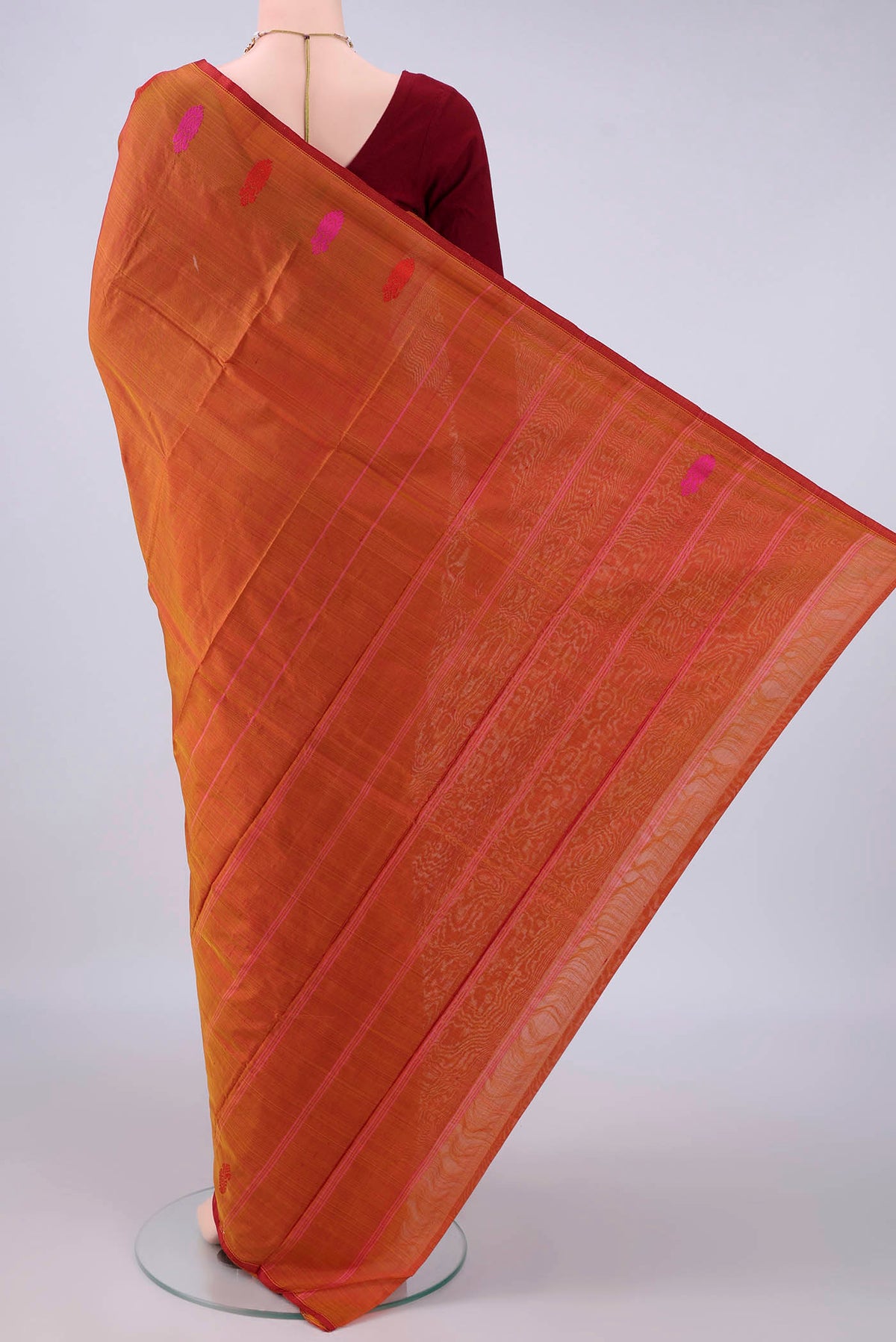 Flat view of Pure Silk Rust Kanchipuram Saree with Plain Body and Thread Border. 