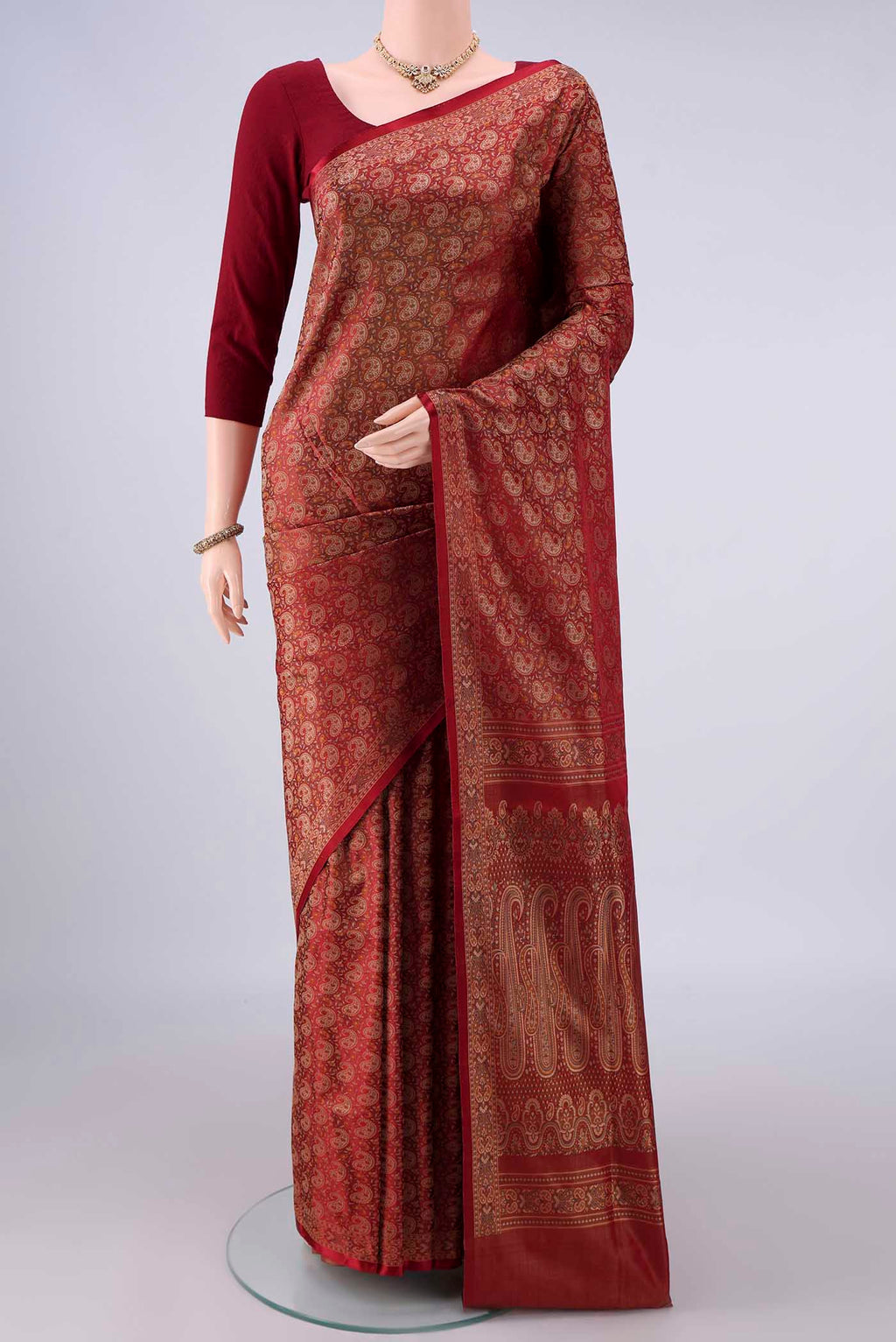 Pure Silk Maroon Banarasi Tanchoi Saree with Thread Brocade on the body and Zari And Thread Border.  displayed on a mannequin