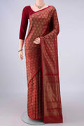 Pure Silk Maroon Banarasi Tanchoi Saree with Thread Brocade on the body and Zari And Thread Border.  displayed on a mannequin