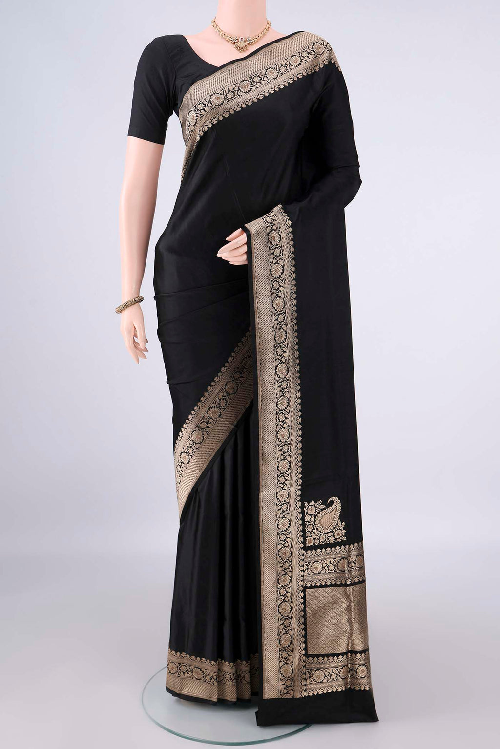 Black Banarasi Saree with Plain Body and Zari Border.  displayed on a mannequin
