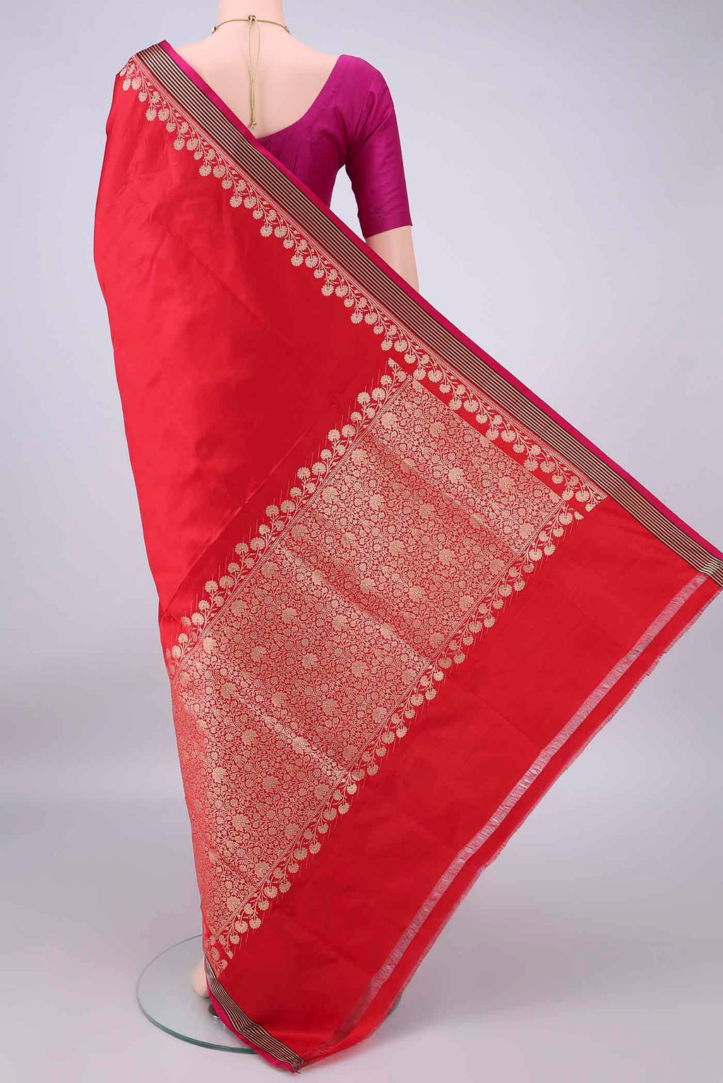 Flat view of Red Banarasi Saree with Plain Body and Zari Border. 