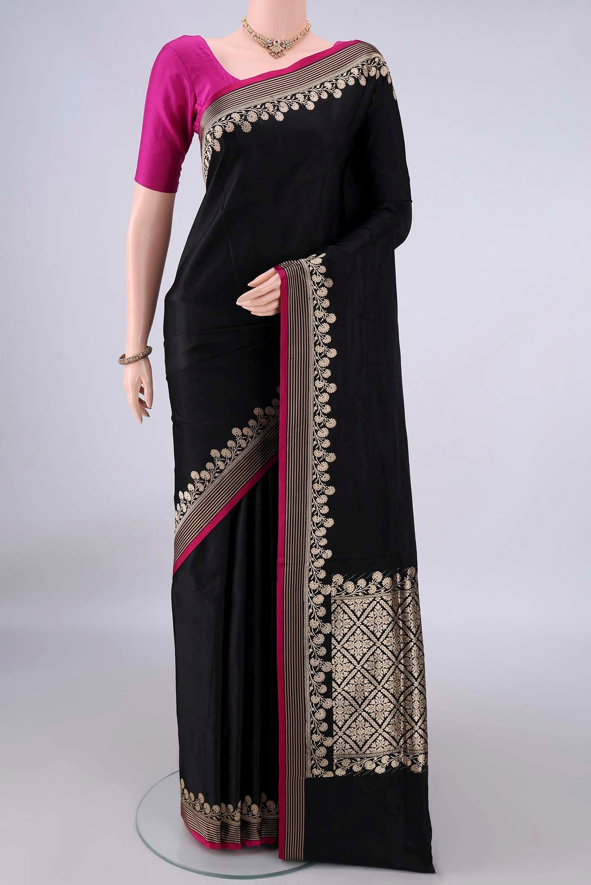 Black Banarasi Saree with Plain Body and Zari Border.  displayed on a mannequin