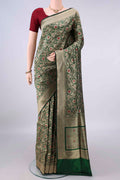 Pure Silk Bottle Green Banarasi Saree with Zari Brocade on the body and Zari Border.  displayed on a mannequin