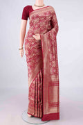 Pure Silk Maroon Banarasi Saree with Zari Brocade on the body and Zari Border.  displayed on a mannequin