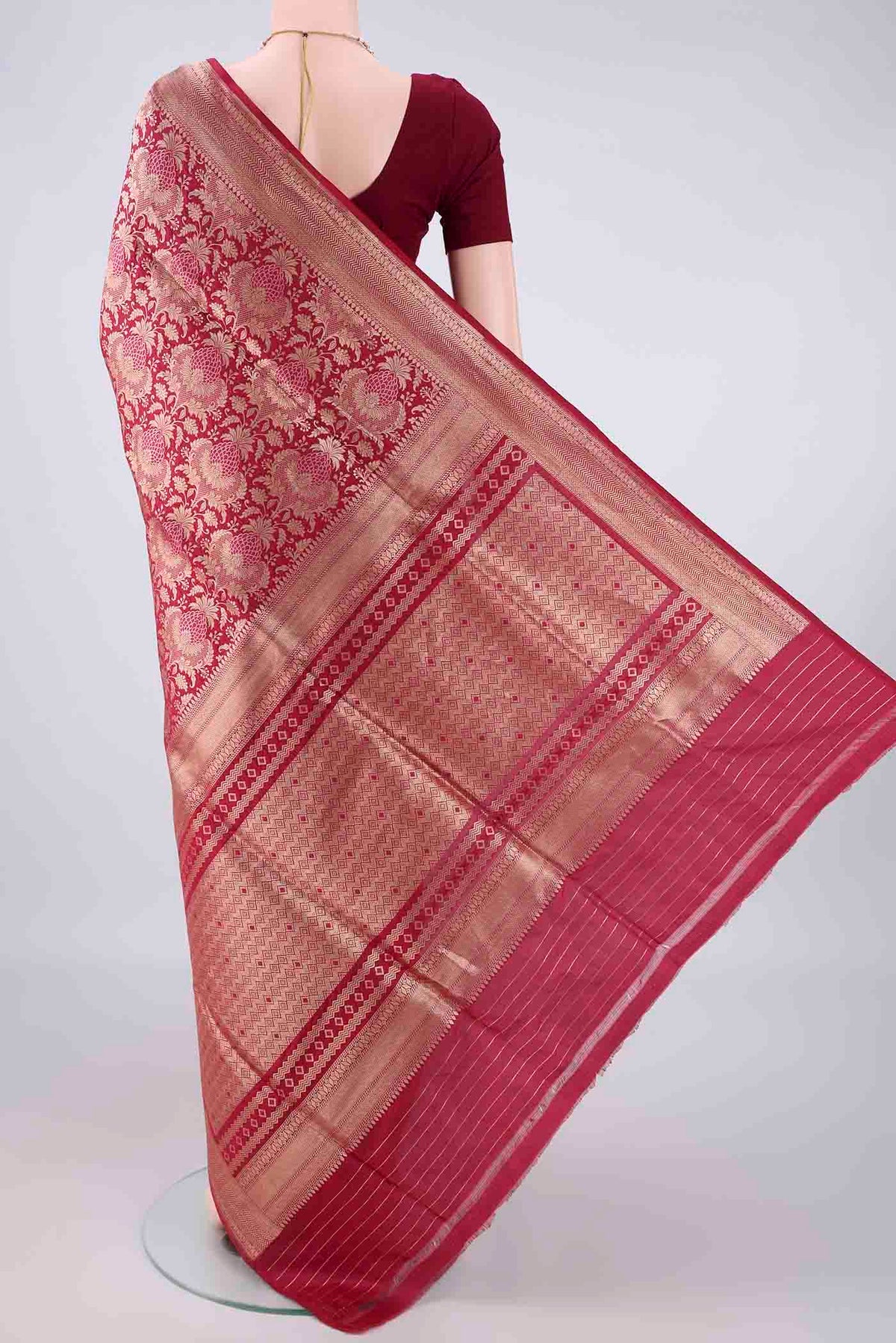 Flat view of Pure Silk Maroon Banarasi Saree with Zari Brocade on the body and Zari Border. 