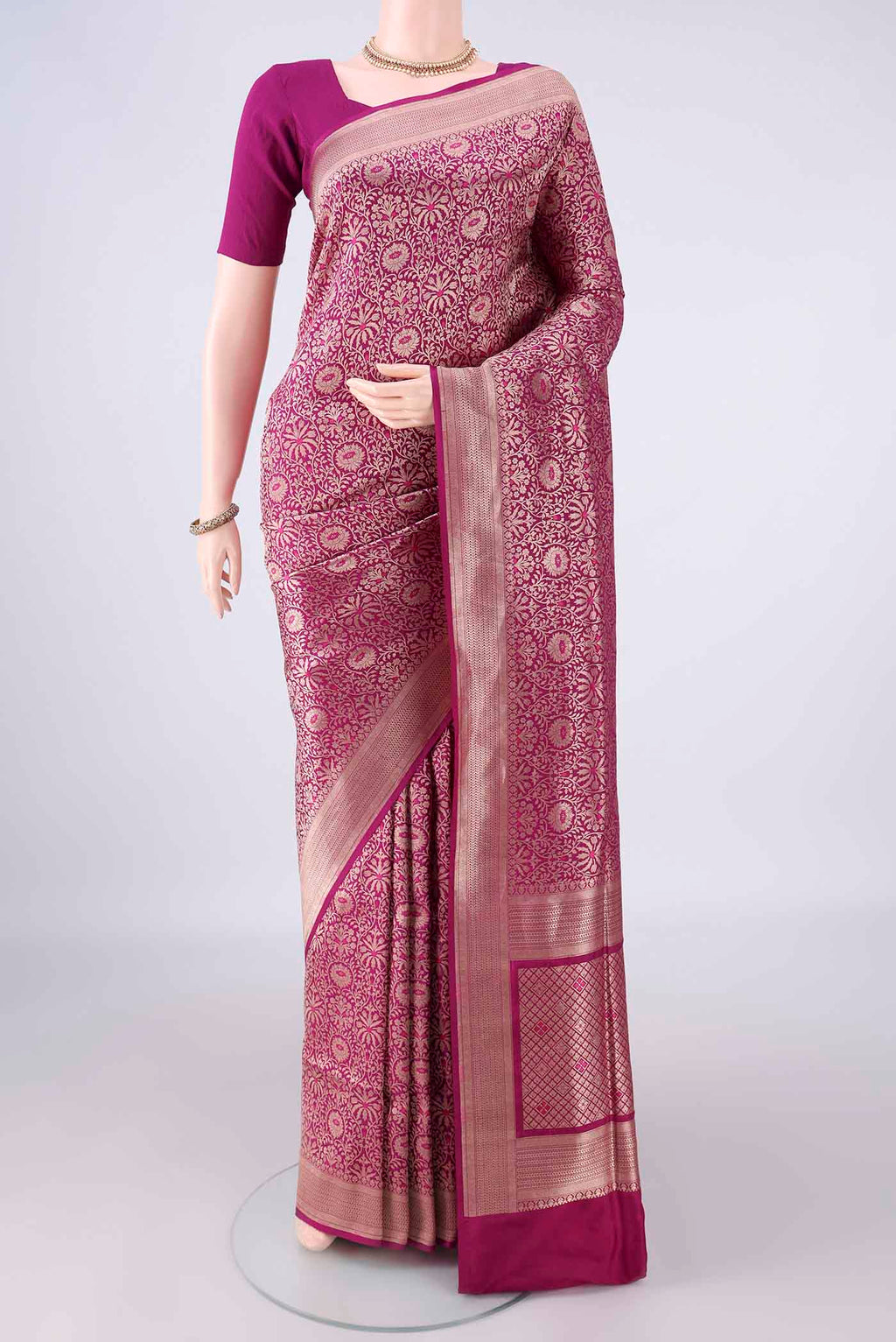 Pure Silk Magenta Banarasi Saree with Zari Brocade on the body and Zari Border.  displayed on a mannequin