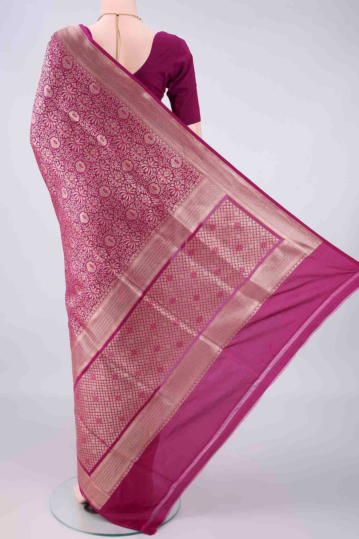 Flat view of Pure Silk Magenta Banarasi Saree with Zari Brocade on the body and Zari Border. 