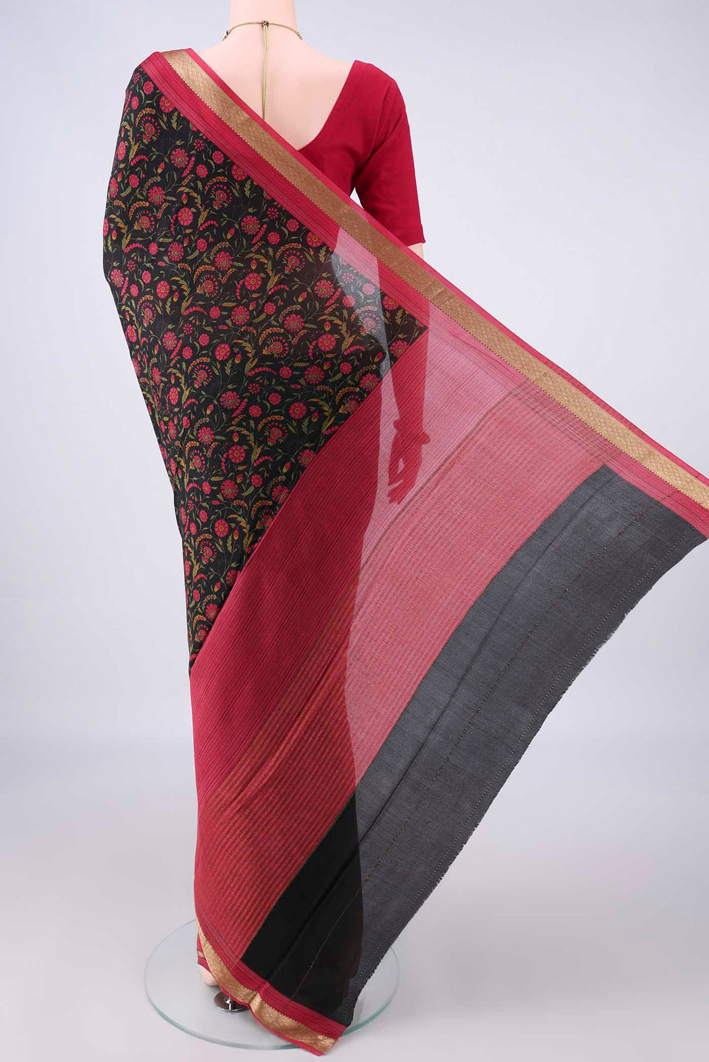 Flat view of Black Mysore Crepe Saree with Printed design on the body and Zari Border. 
