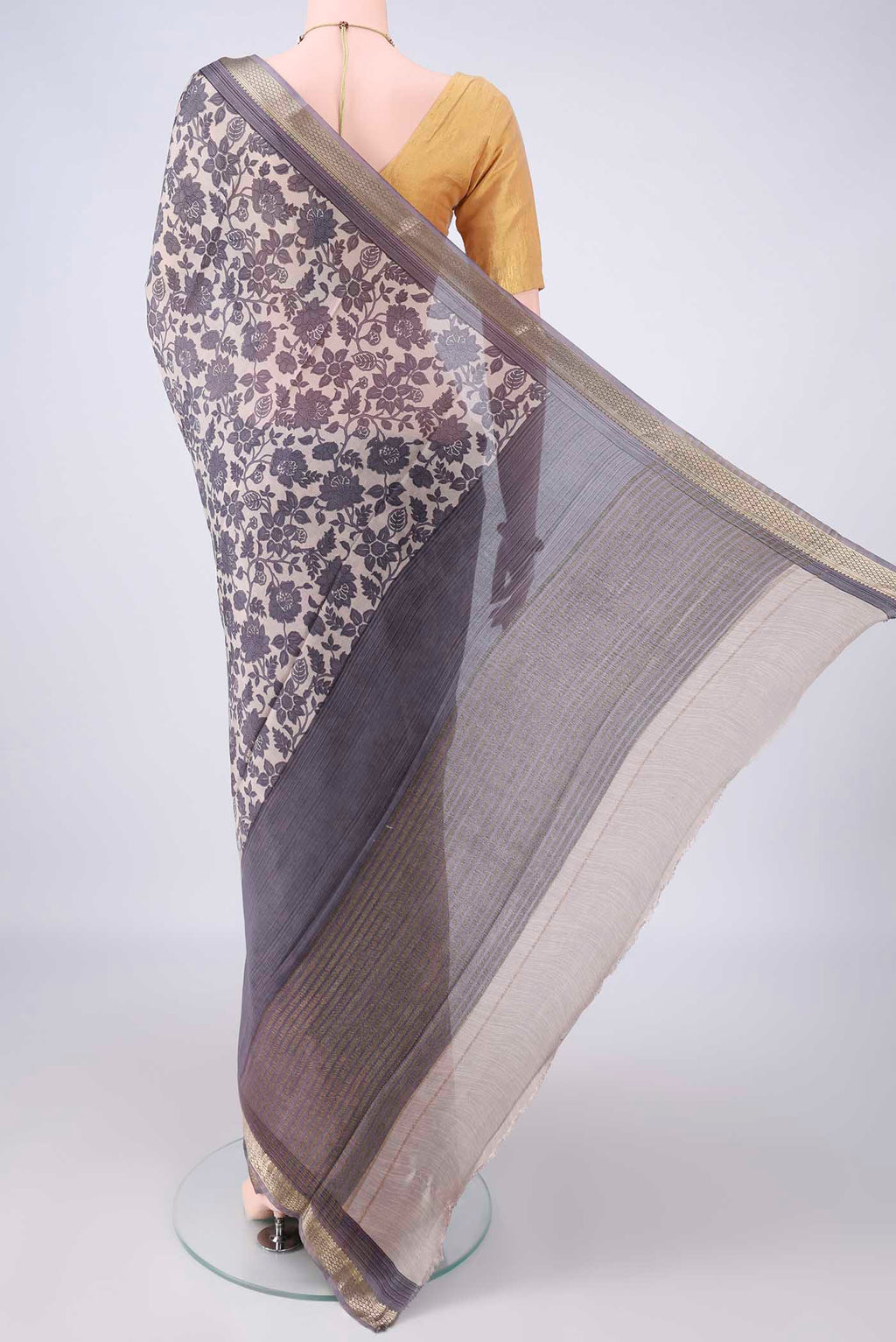 Flat view of Beige Mysore Crepe Saree with Printed design on the body and Zari Border. 