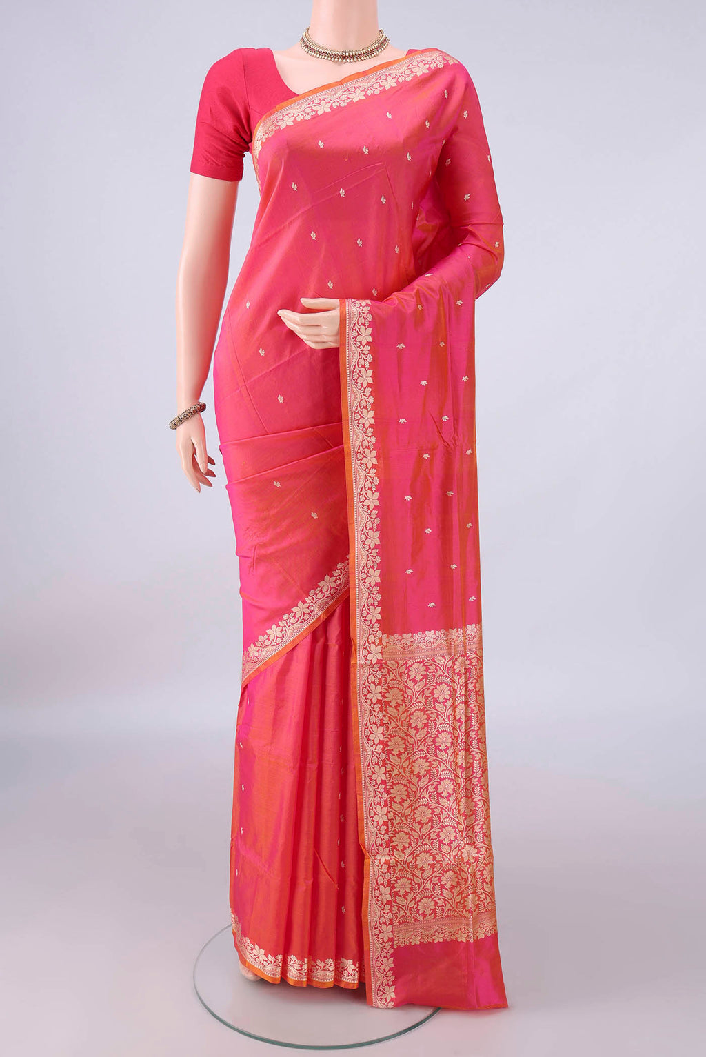 Pure Silk Pinkish Yellow Dual Tone Banarasi Katan Saree with Thread Butta on the body and Thread Border.  displayed on a mannequin