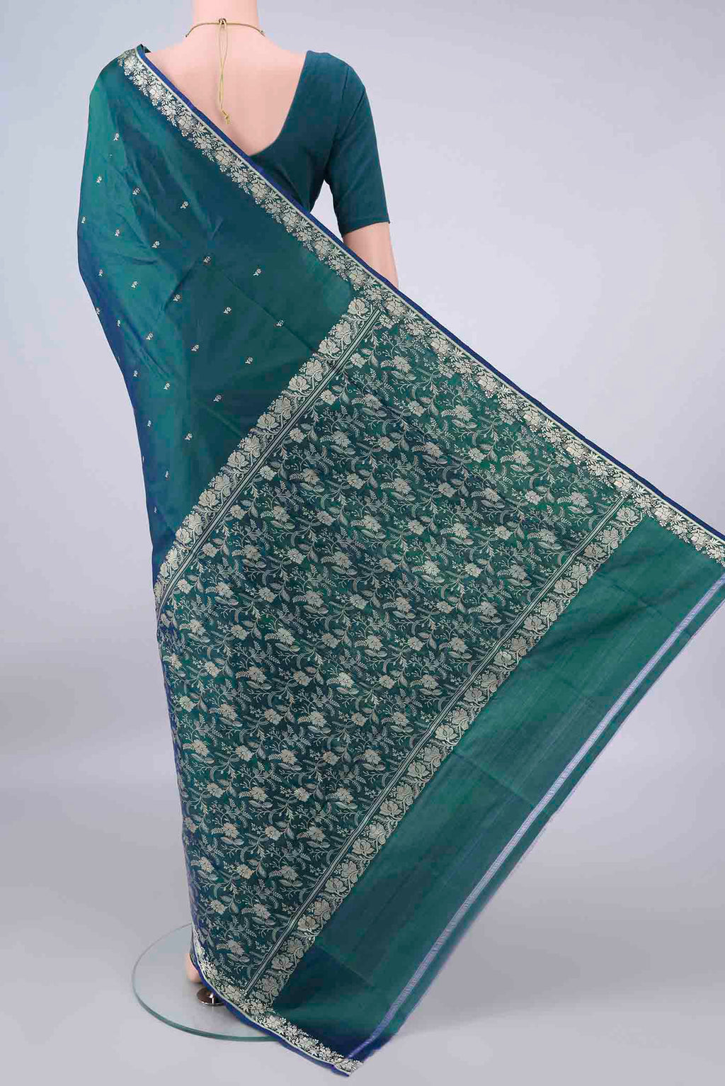Flat view of Pure Silk Peacock Blue Dual Tone Banarasi Katan Saree with Thread Butta on the body and Thread Border. 