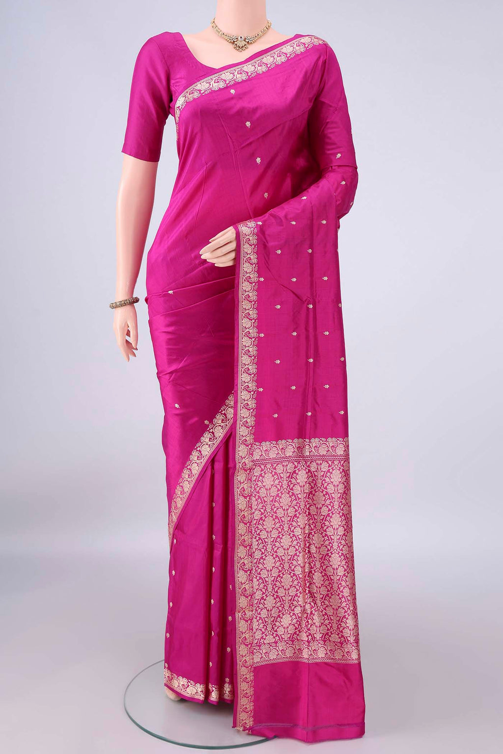 Pure Silk Rani Pink Banarasi Katan Saree with Thread Butta on the body and Thread Border.  displayed on a mannequin