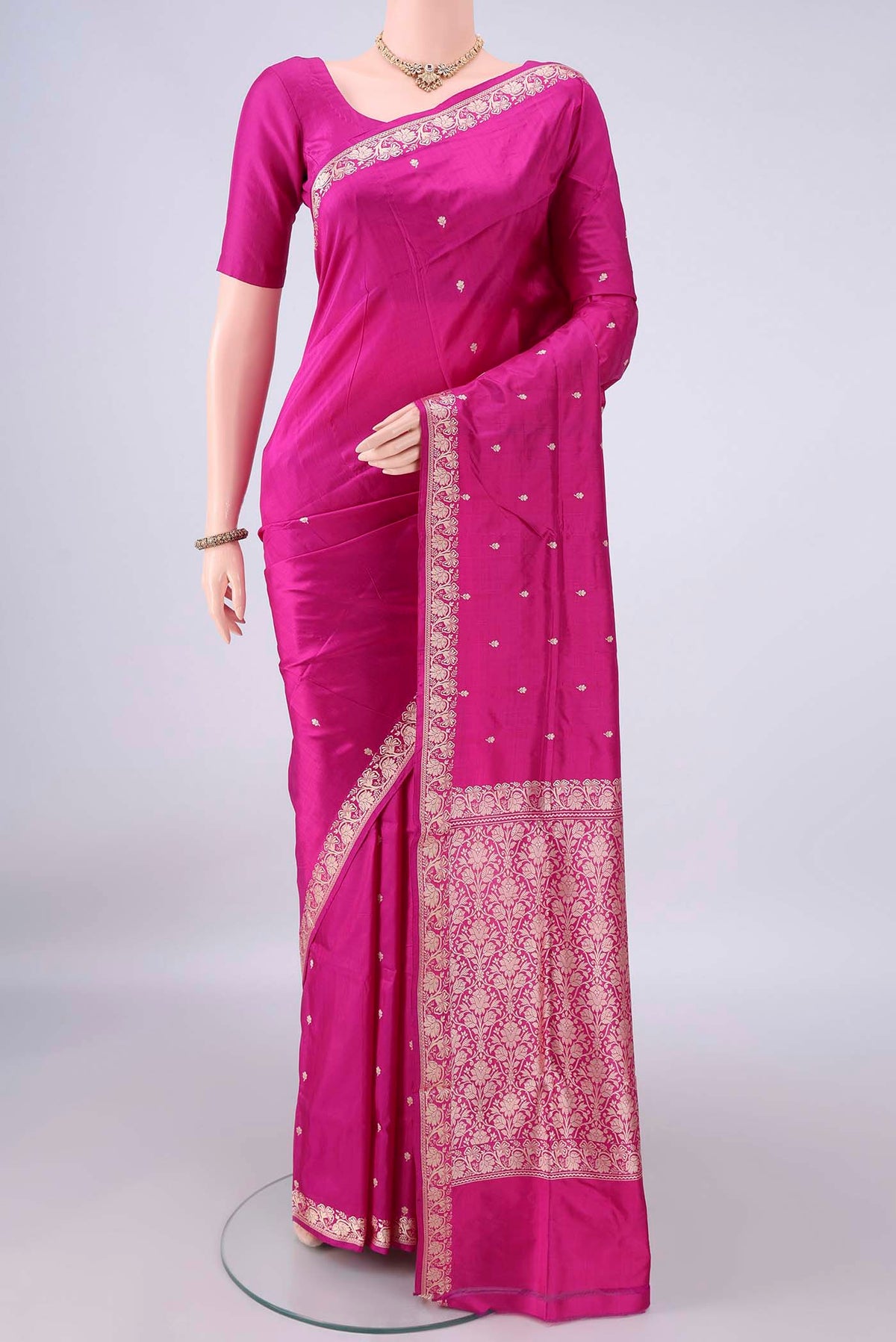 Pure Silk Rani Pink Banarasi Katan Saree with Thread Butta on the body and Thread Border.  displayed on a mannequin