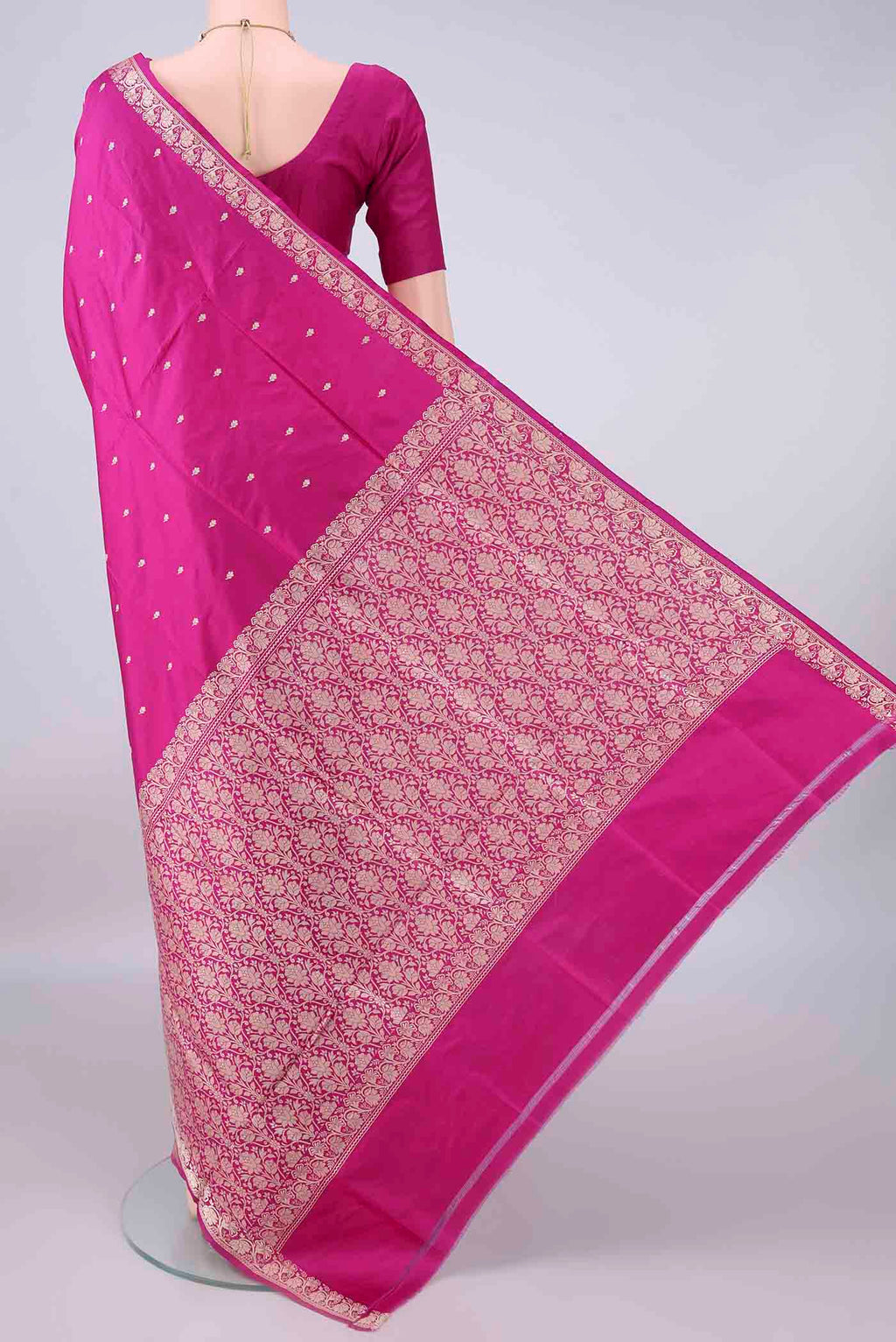 Flat view of Pure Silk Rani Pink Banarasi Katan Saree with Thread Butta on the body and Thread Border. 