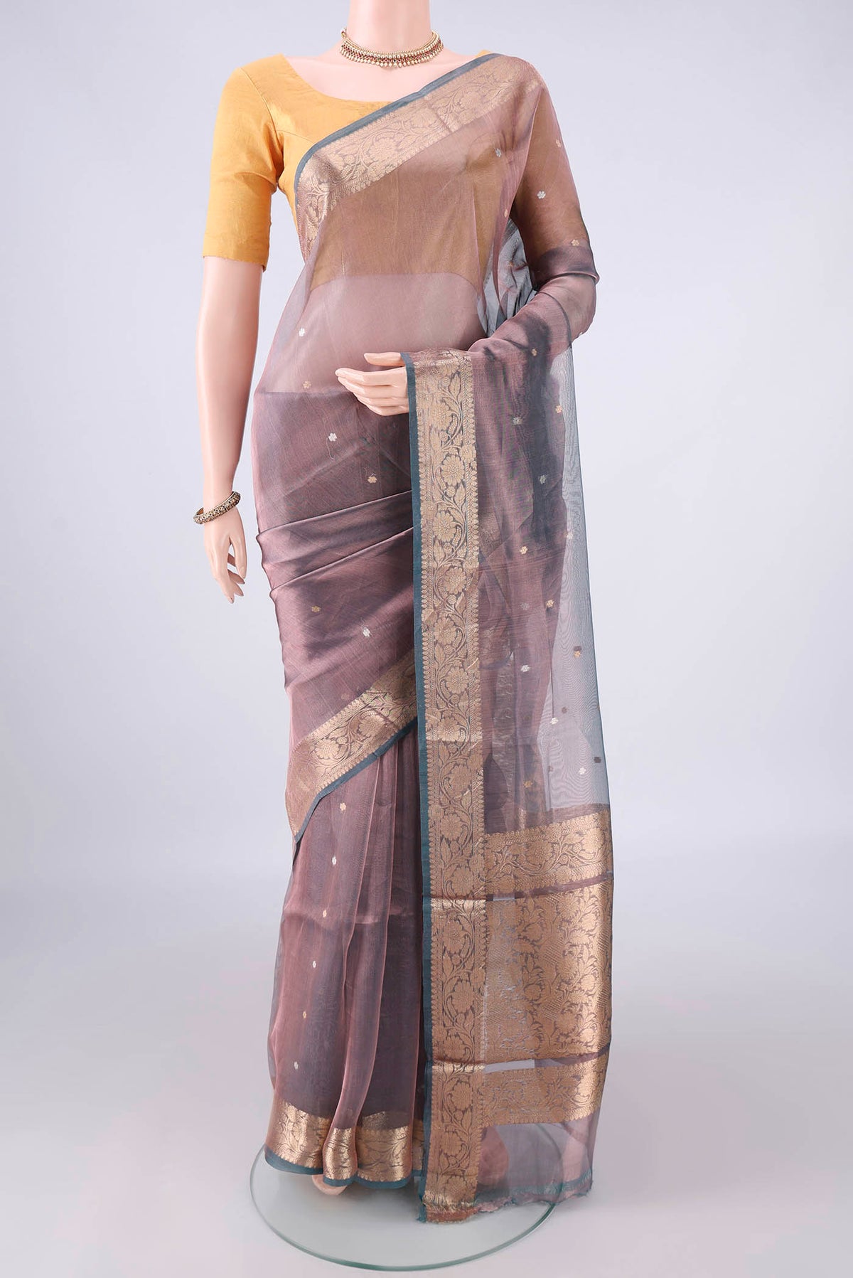 Purple Dual Tone Organza Saree with Zari Butta on the body and Zari Border.  displayed on a mannequin