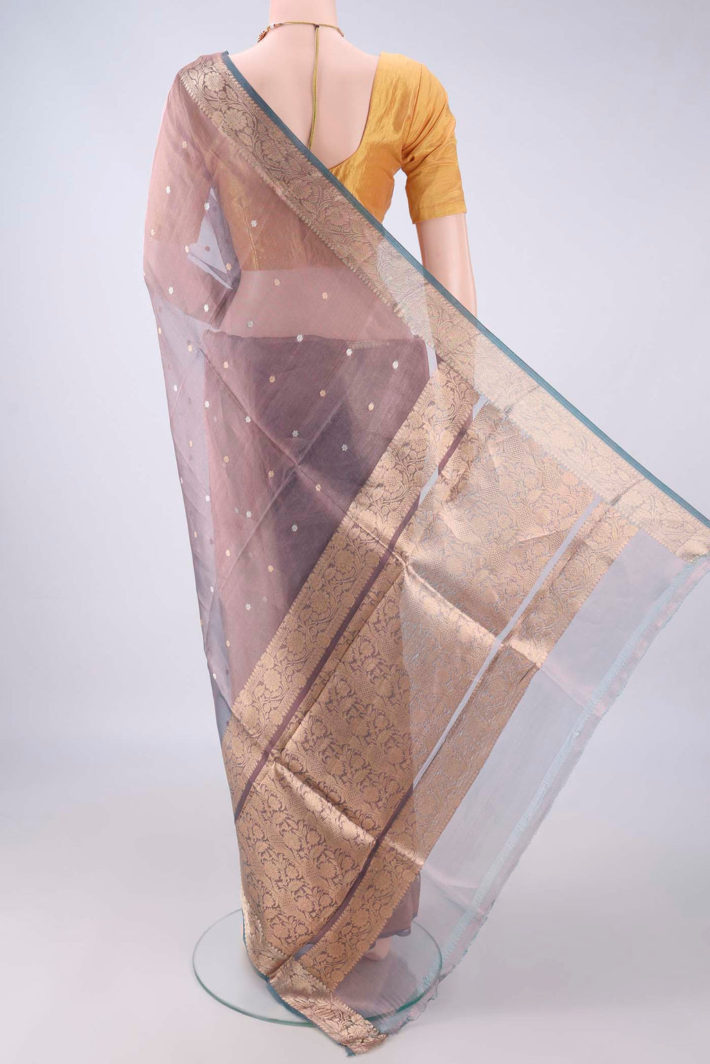 Flat view of Purple Dual Tone Organza Saree with Zari Butta on the body and Zari Border. 