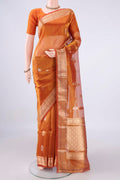Rust Dual Tone Organza Saree with Zari Butta on the body and Zari Border.  displayed on a mannequin