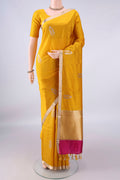 Pure Silk Yellow Banarasi Katan Saree with Zari Butta on the body and Zari Border.  displayed on a mannequin
