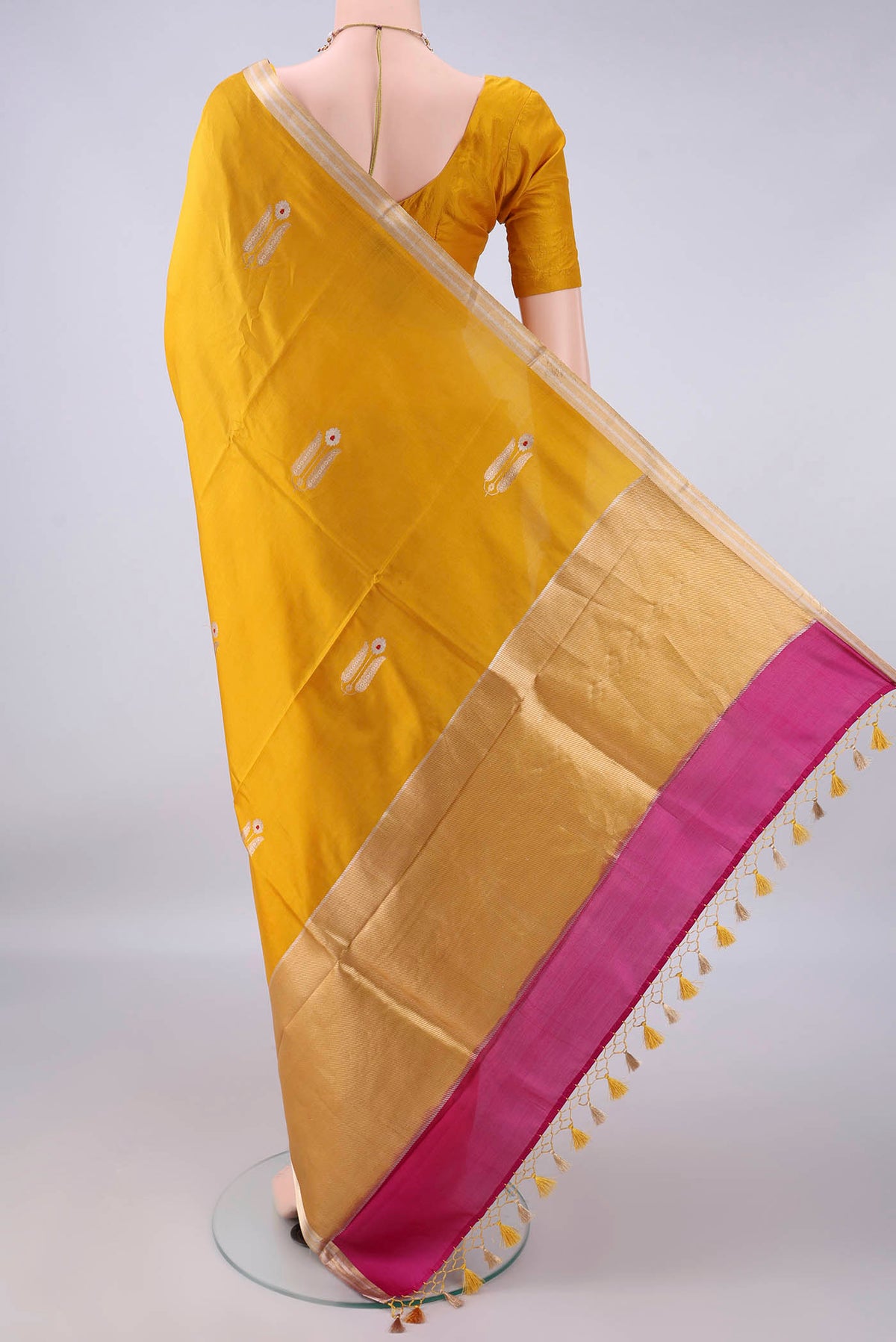 Flat view of Pure Silk Yellow Banarasi Katan Saree with Zari Butta on the body and Zari Border. 