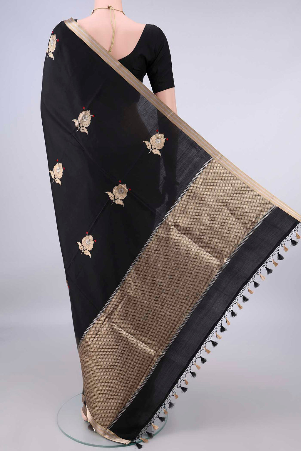 Flat view of Pure Silk Black Banarasi Katan Saree with Zari Butta on the body and Zari Border. 