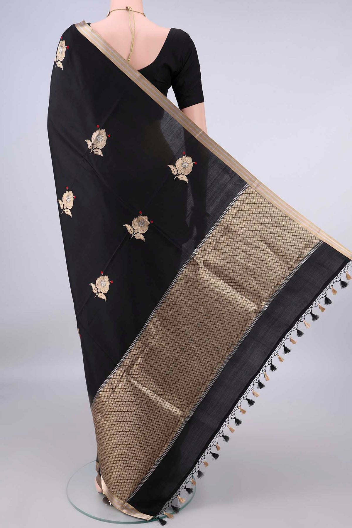 Flat view of Pure Silk Black Banarasi Katan Saree with Zari Butta on the body and Zari Border. 