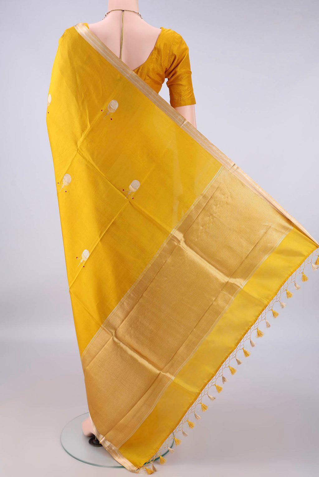 Flat view of Pure Silk Yellow Banarasi Katan Saree with Zari Butta on the body and Zari Border. 