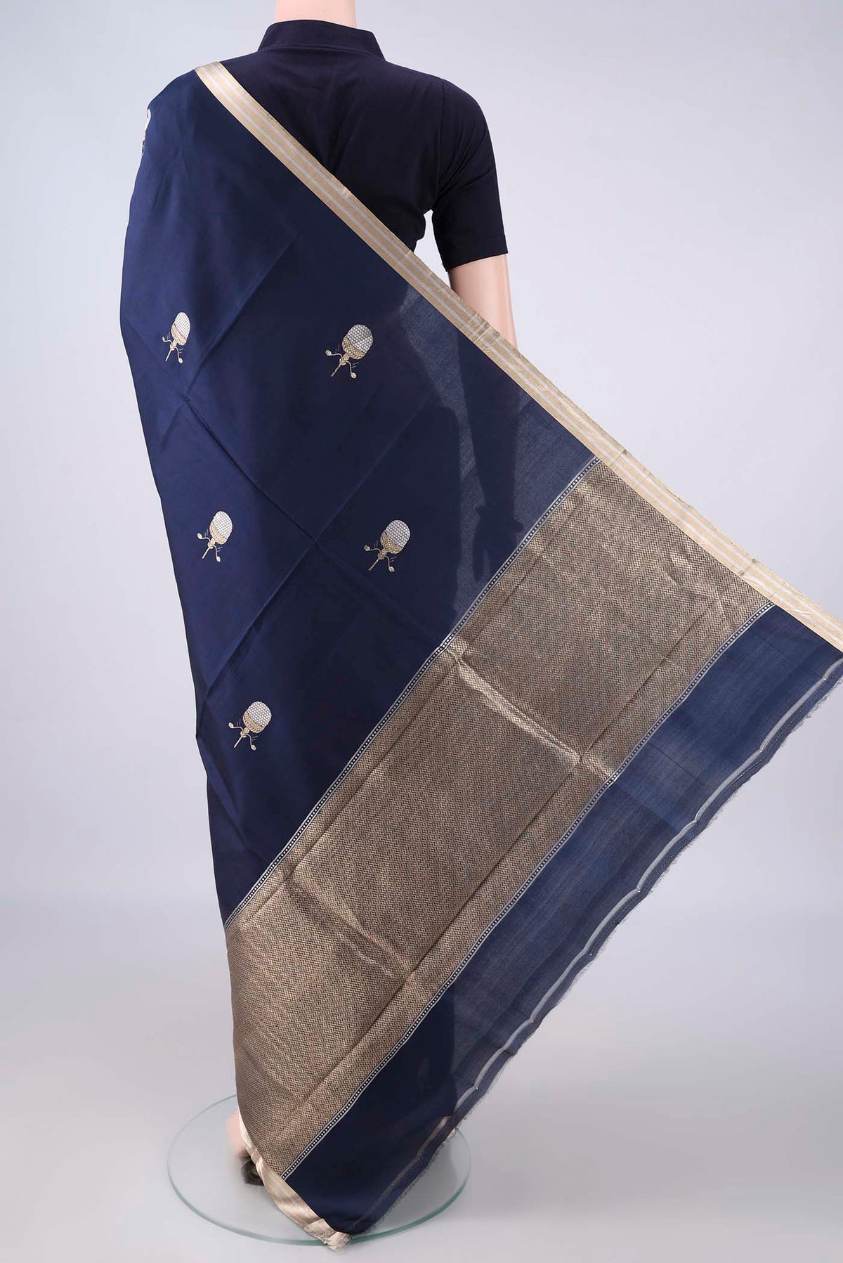Flat view of Pure Silk Navy Blue Banarasi Saree with Zari Butta on the body and Zari Border. 