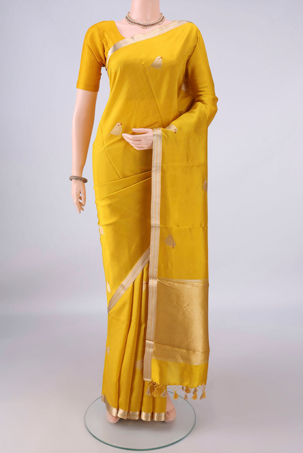 Pure Silk Yellow Banarasi Katan Saree with Zari Butta on the body and Zari Border.  displayed on a mannequin