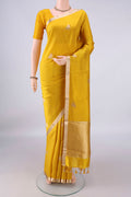 Pure Silk Yellow Banarasi Katan Saree with Zari Butta on the body and Zari Border.  displayed on a mannequin