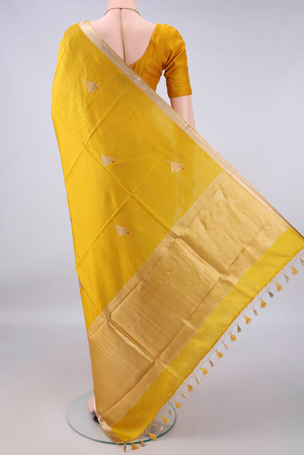 Flat view of Pure Silk Yellow Banarasi Katan Saree with Zari Butta on the body and Zari Border. 