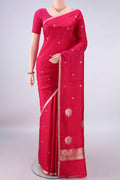 Pure Silk Dark Pink Banarasi Katan Saree with Zari Butta on the body and Zari Border.  displayed on a mannequin