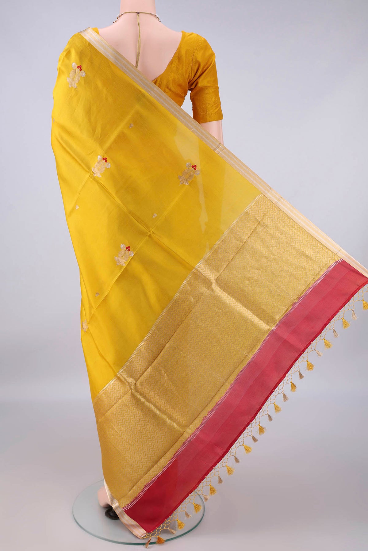 Flat view of Pure Silk Yellow Banarasi Katan Saree with Zari Butta on the body and Zari Border. 
