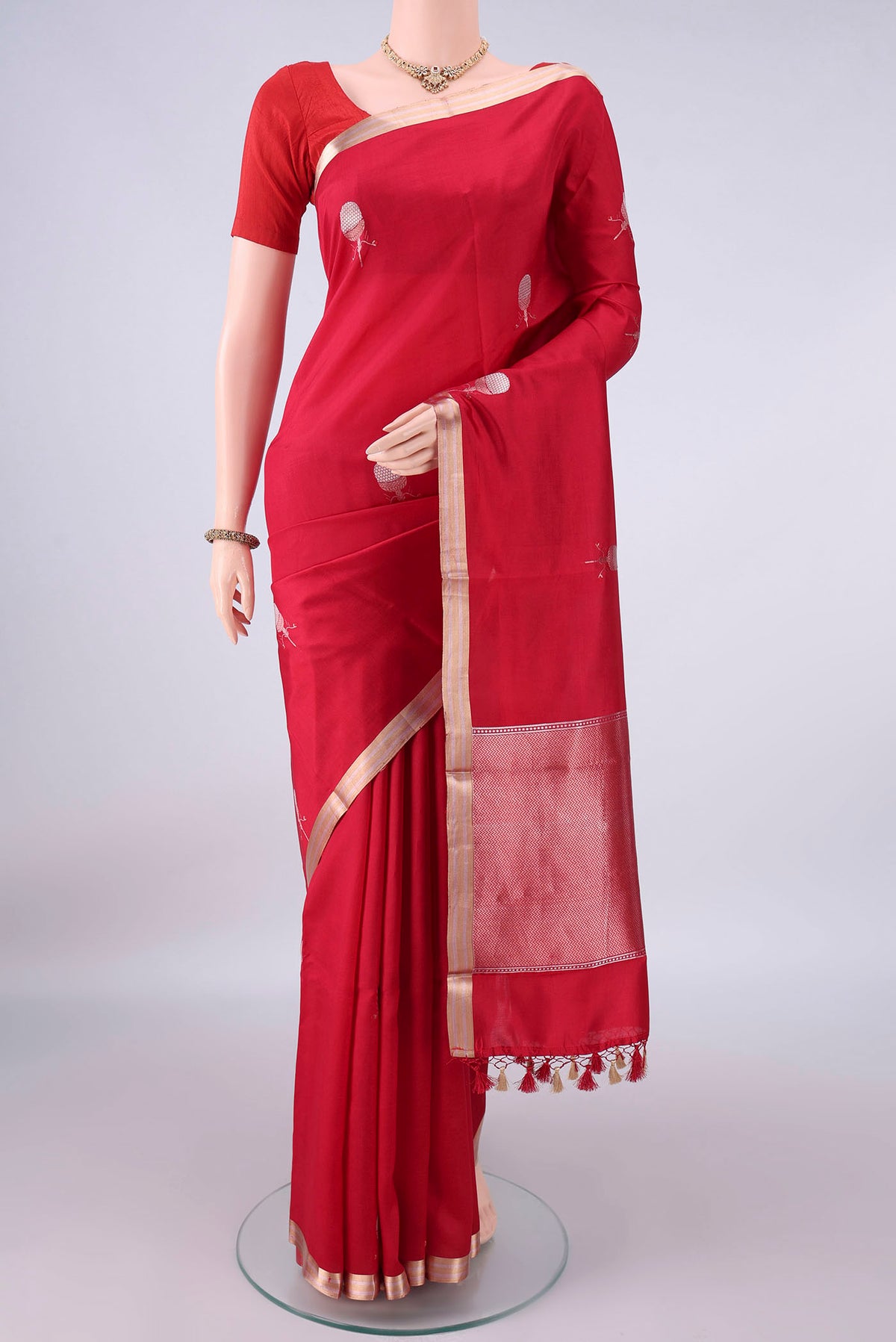 Pure Silk Red Banarasi Katan Saree with Zari Butta on the body and Zari Border.  displayed on a mannequin