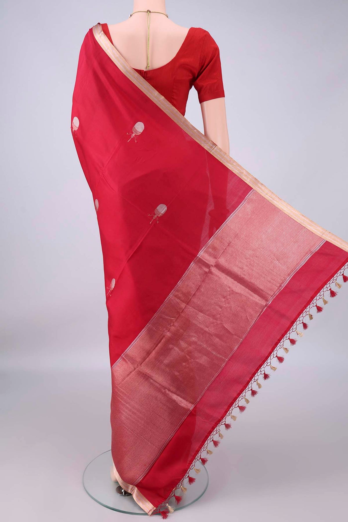 Flat view of Pure Silk Red Banarasi Katan Saree with Zari Butta on the body and Zari Border. 