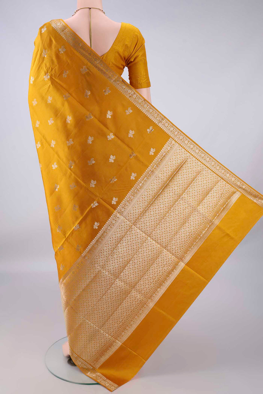 Flat view of Pure Silk Mustard Banarasi Raw Saree with Zari Butta on the body and Zari Border. 