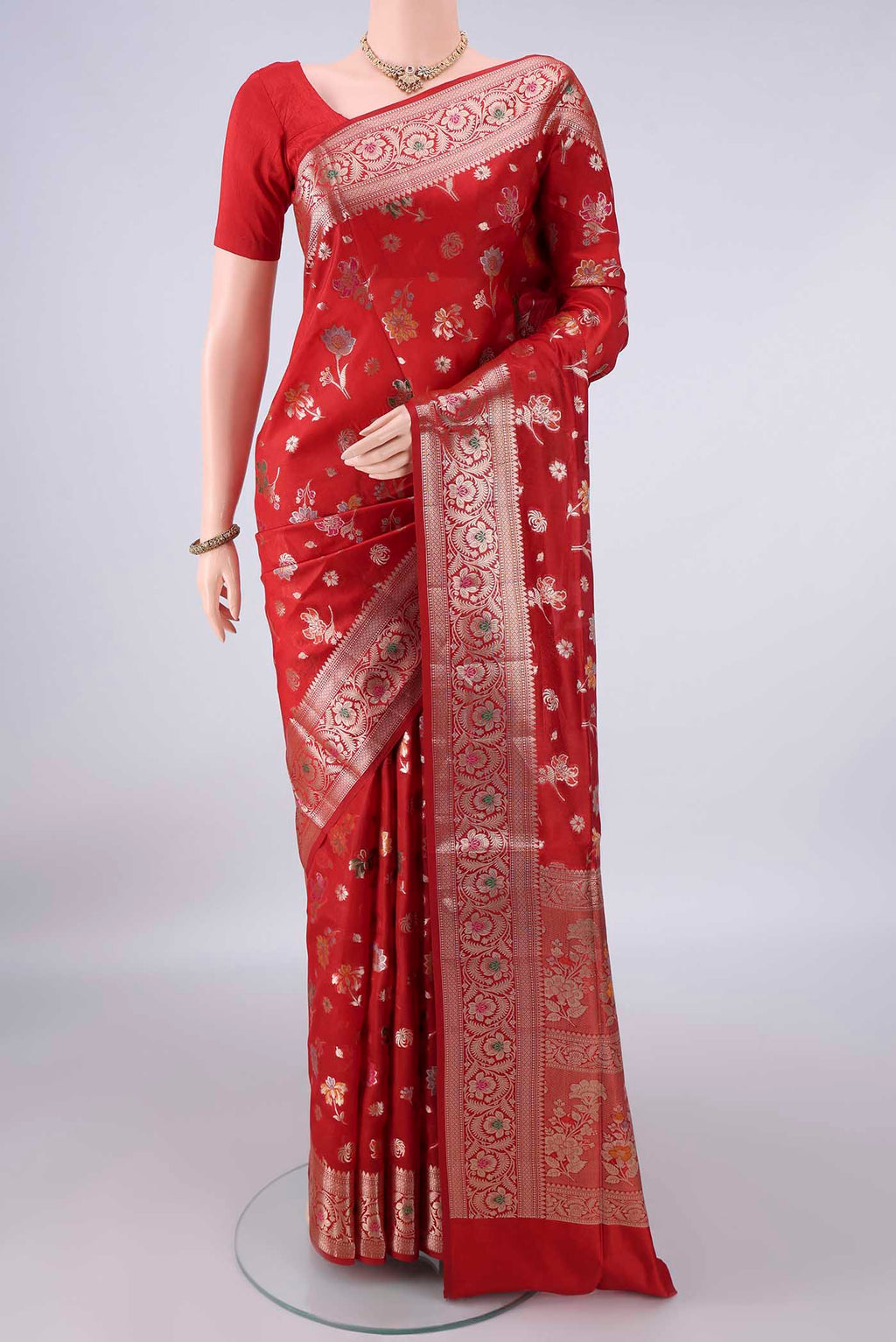 Pure Silk Red Banarasi Raw Saree with Zari And Thread Butta on the body and Zari And Thread Border.  displayed on a mannequin