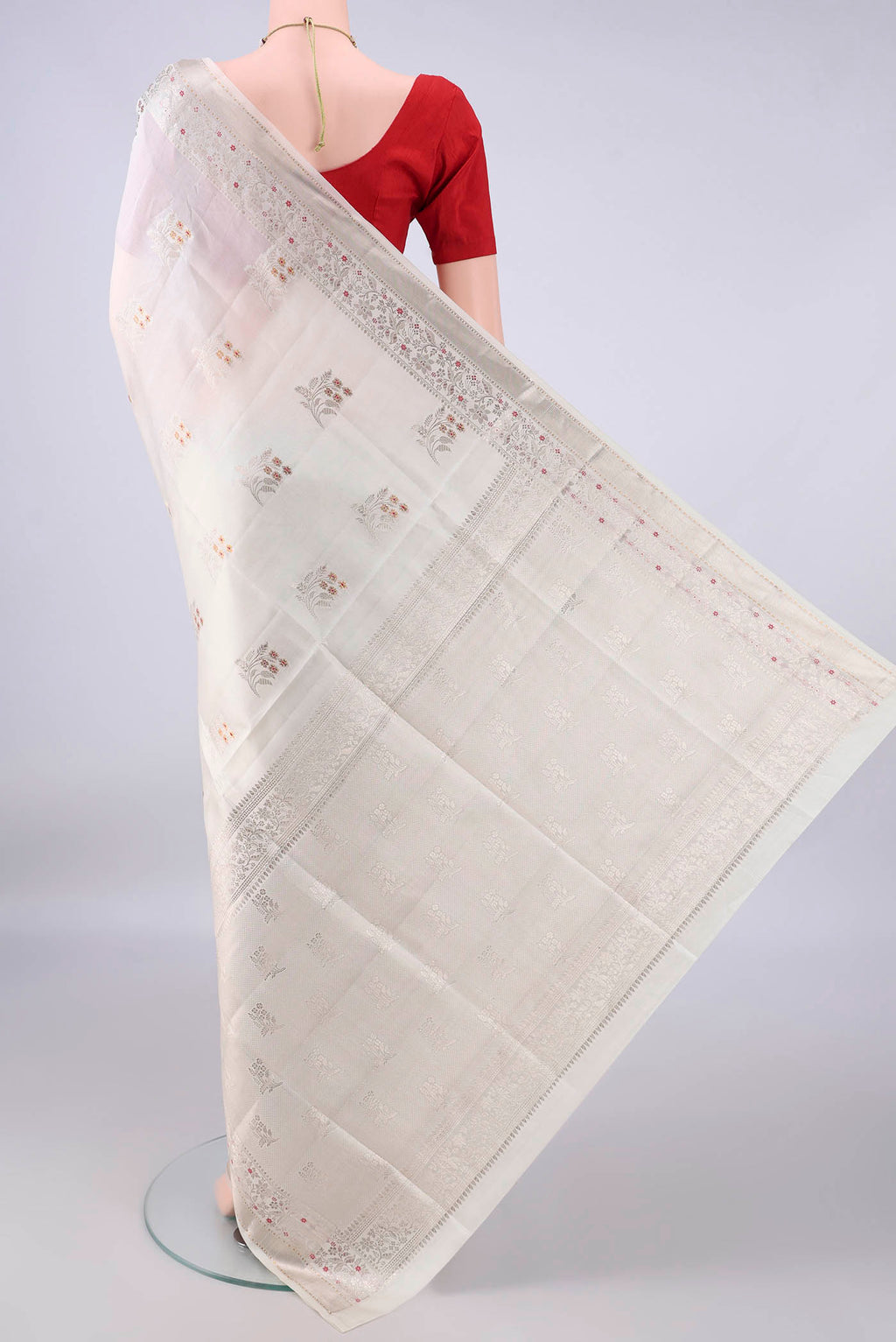 Flat view of Pure Silk Off White Banarasi Raw Saree with Zari Butta on the body and Zari And Thread Border. 