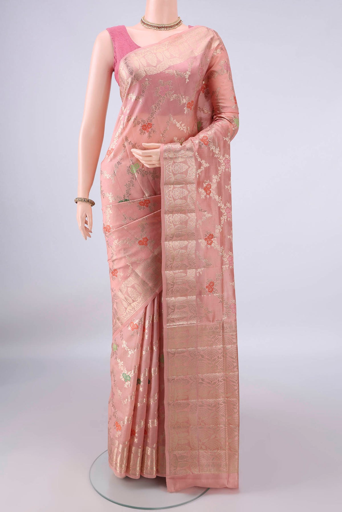 Pure Silk Peach Banarasi Raw Saree with Zari Brocade on the body and Zari Border.  displayed on a mannequin