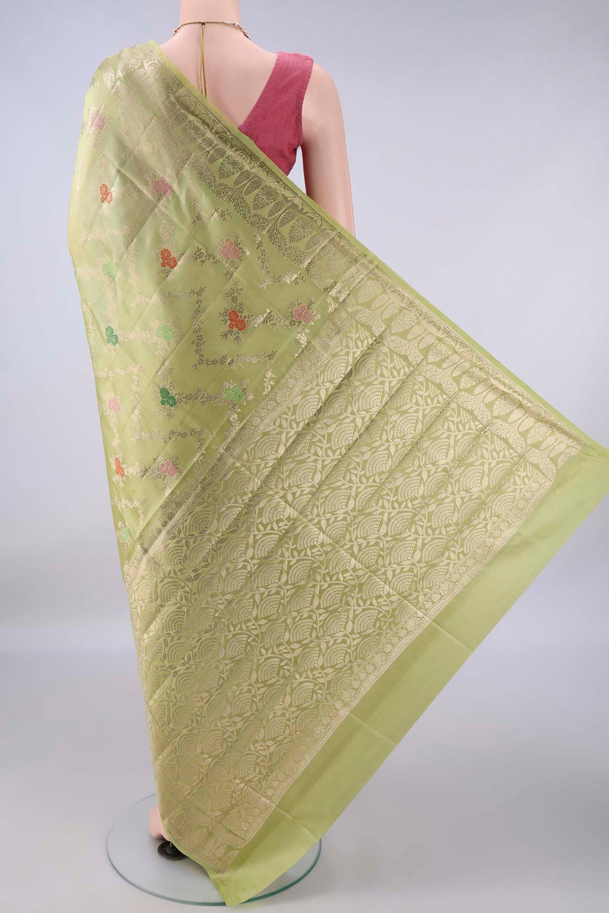 Flat view of Pure Silk Light Green Banarasi Raw Saree with Zari Brocade on the body and Zari Border. 