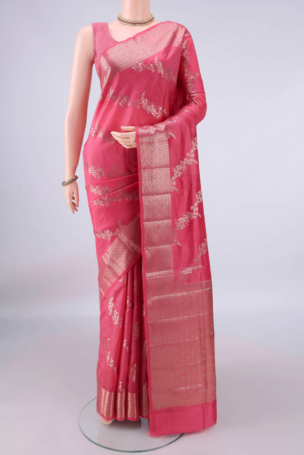 Pure Silk Pink Banarasi Raw Saree with Zari Brocade on the body and Zari Border.  displayed on a mannequin