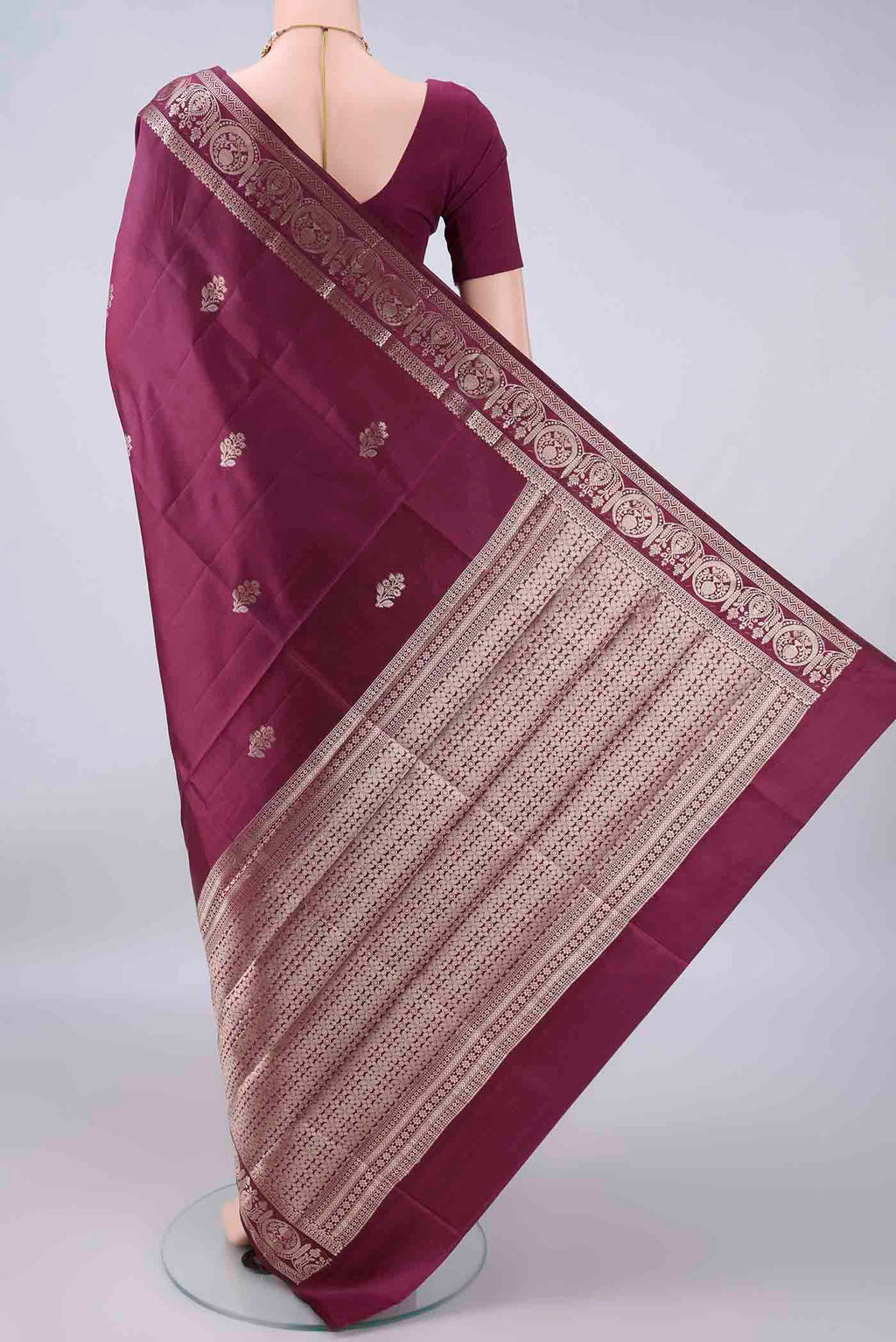 Flat view of Pure Silk Burgundy Banarasi Raw Saree with Zari Butta on the body and Zari Border. 