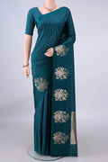 Pure Silk Teal Banarasi Katan Saree with Stripes on the body and Zari Border.  displayed on a mannequin