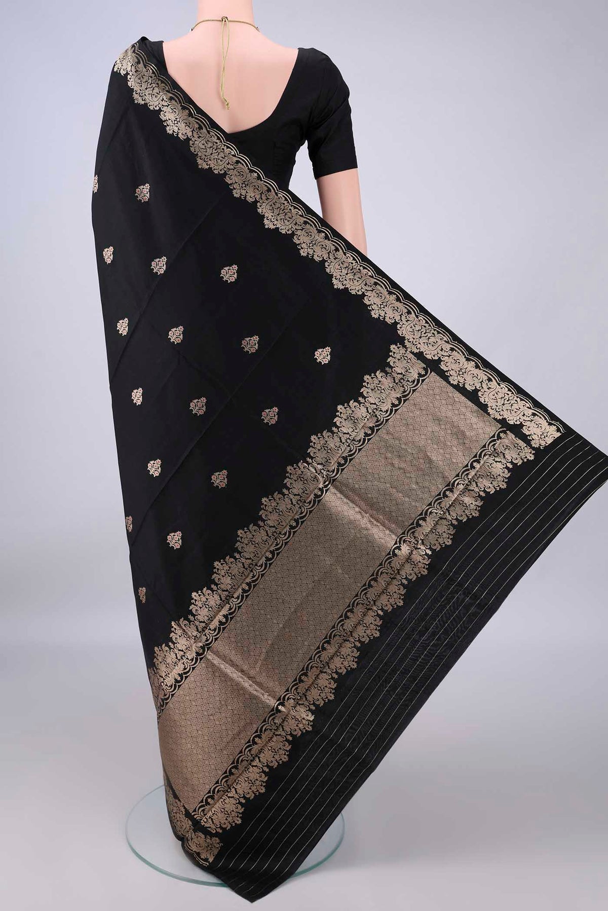 Flat view of Pure Silk Black Banarasi Katan Saree with Zari Butta on the body and Zari Border. 