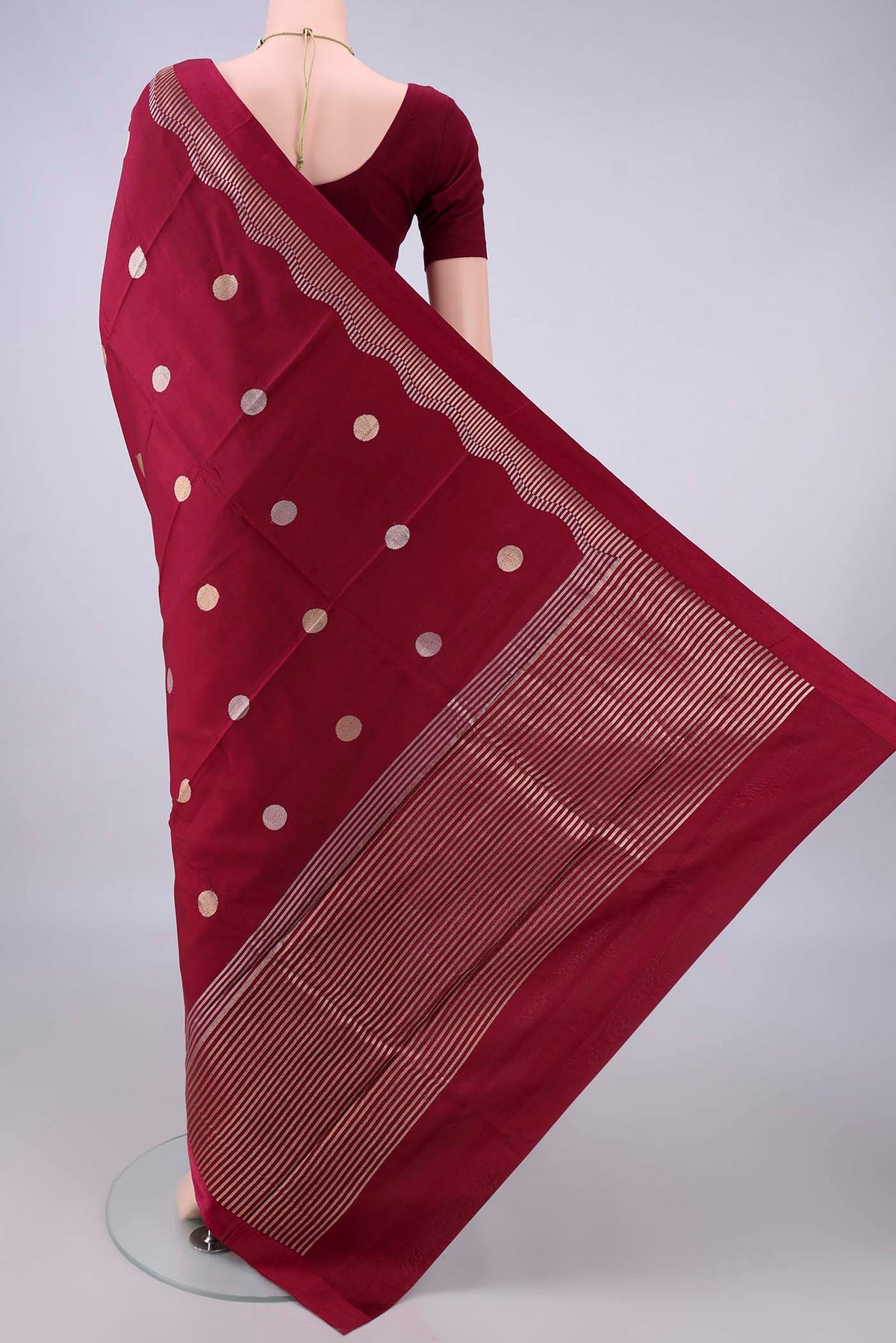 Flat view of Pure Silk Maroon Banarasi Katan Saree with Zari Butta on the body and Zari Border. 