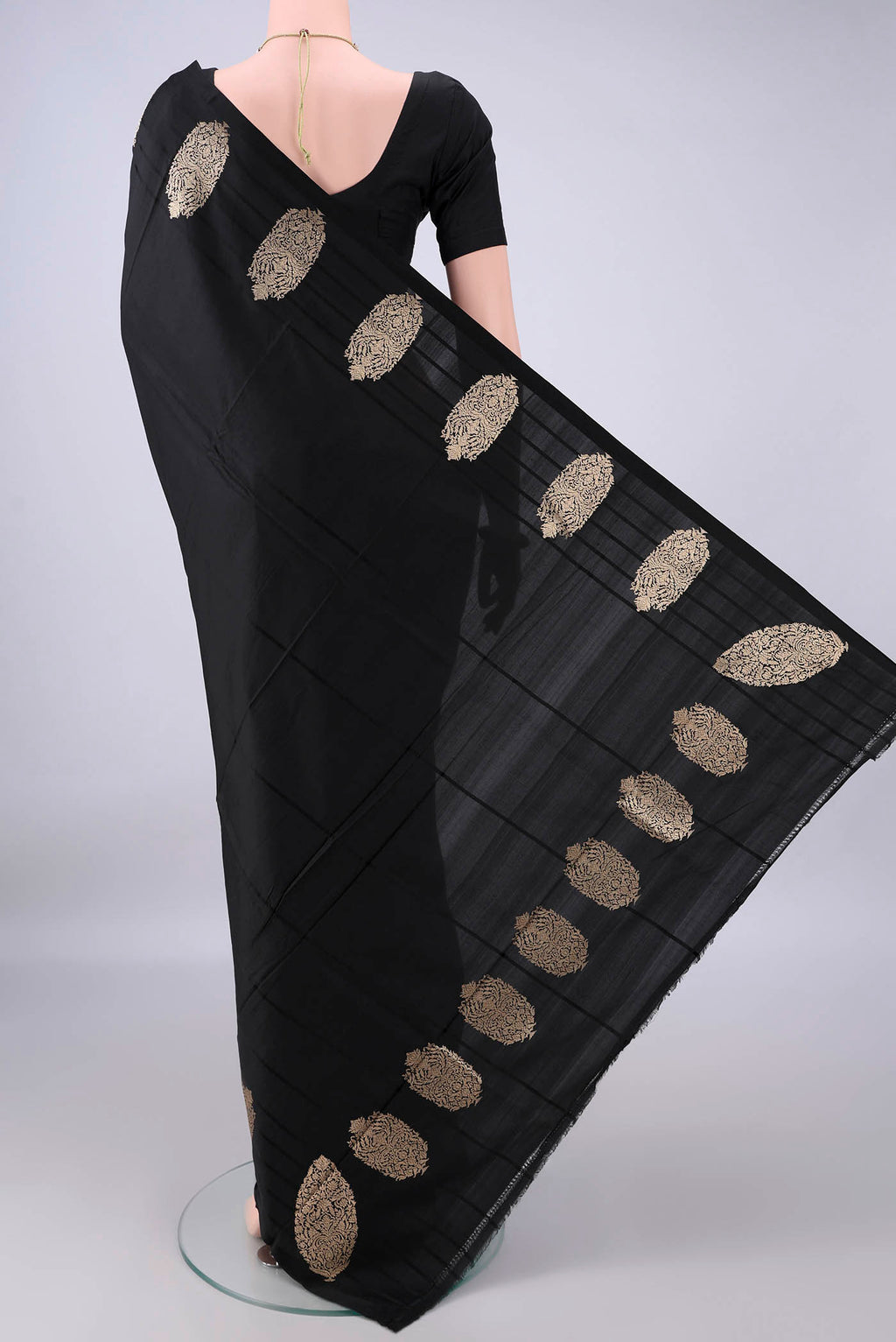 Flat view of Pure Silk Black Banarasi Katan Saree with Plain Body and Zari Border. 