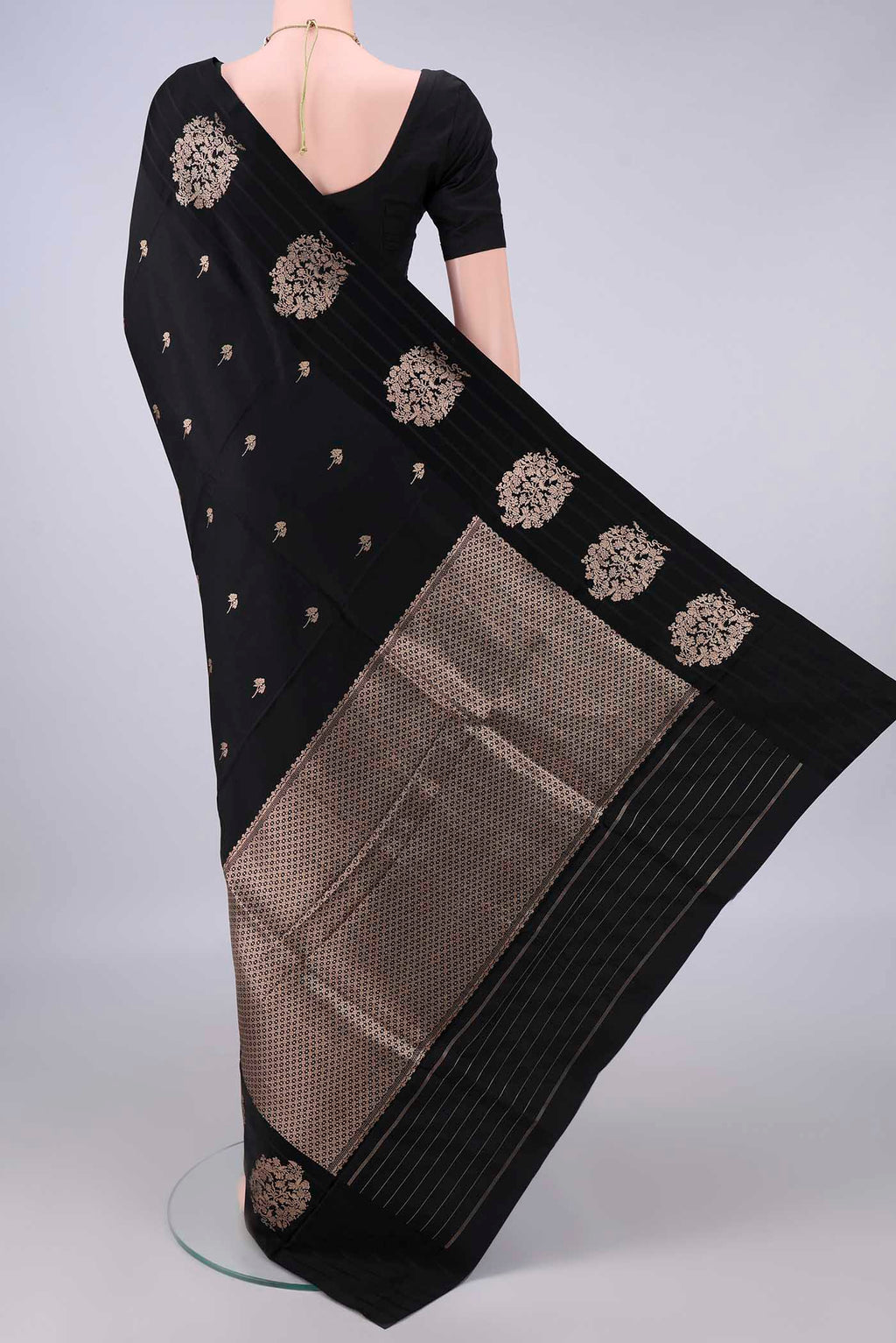 Flat view of Pure Silk Black Banarasi Katan Saree with Zari Butta on the body and Zari Border. 